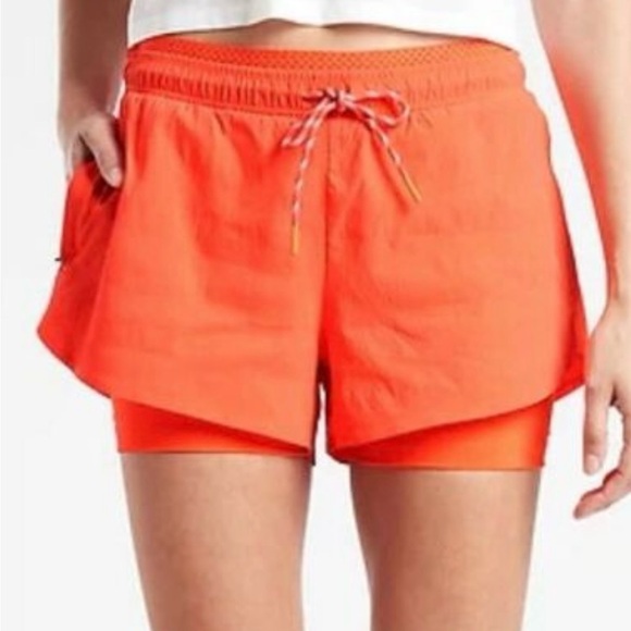 Athleta Pants - Athleta orange crest 2 in 1 shortie size 12